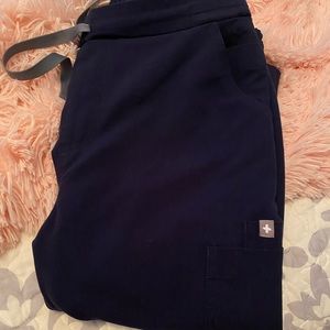 Navy blue FIGS yola skinny scrub pants